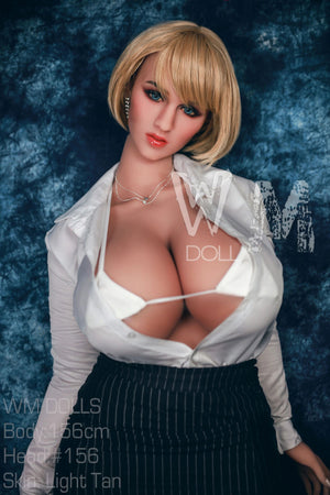 Sex doll wearing a white shirt and black skirt against a blue textured background with 'W&M DOLLS' branding.